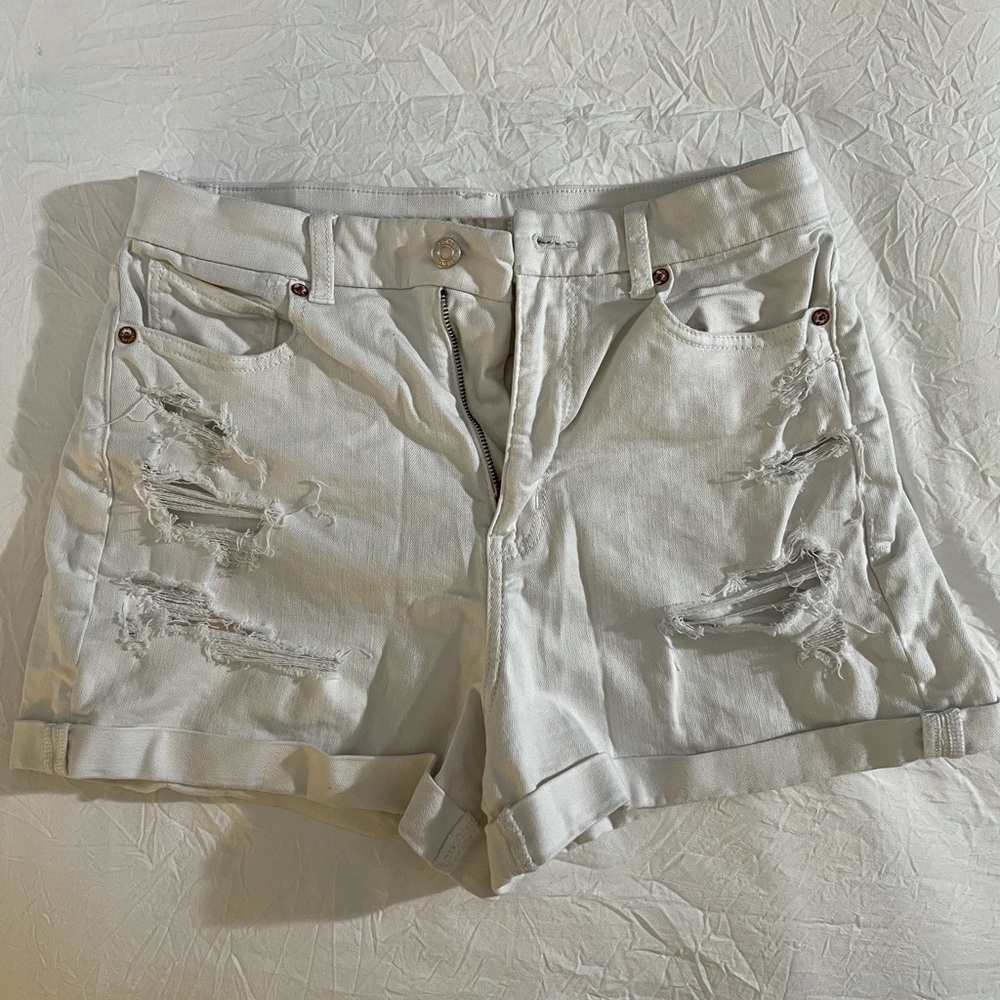 Distressed white denim shorts